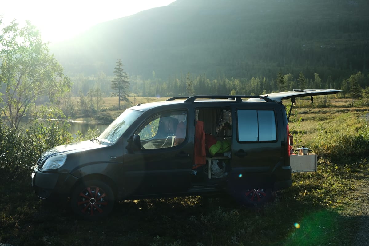 Lotte, our converted Fiat Doblo microcamper, parked in the Norwegian mountains at dusk, ready for dinner.